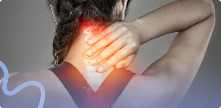 Woman holding the back of her neck with pain highlighted along the cervical spine