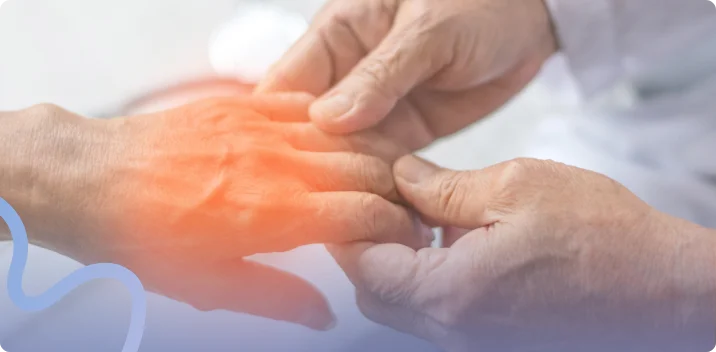 Provider examining a patient's hand with nerve discomfort highlighted across the knuckles
